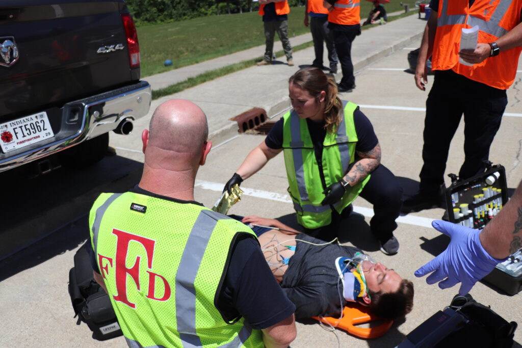 emts helping man on stretcher